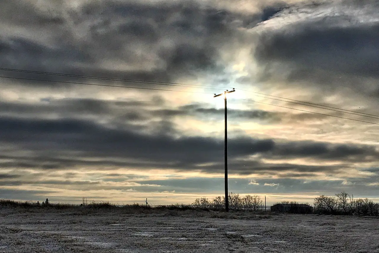 Power pole under a dramatic winter sky, 2018