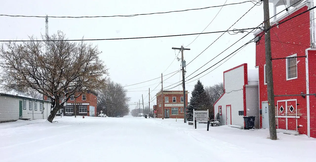 Snowy main street with museum and brick buildings, 2019